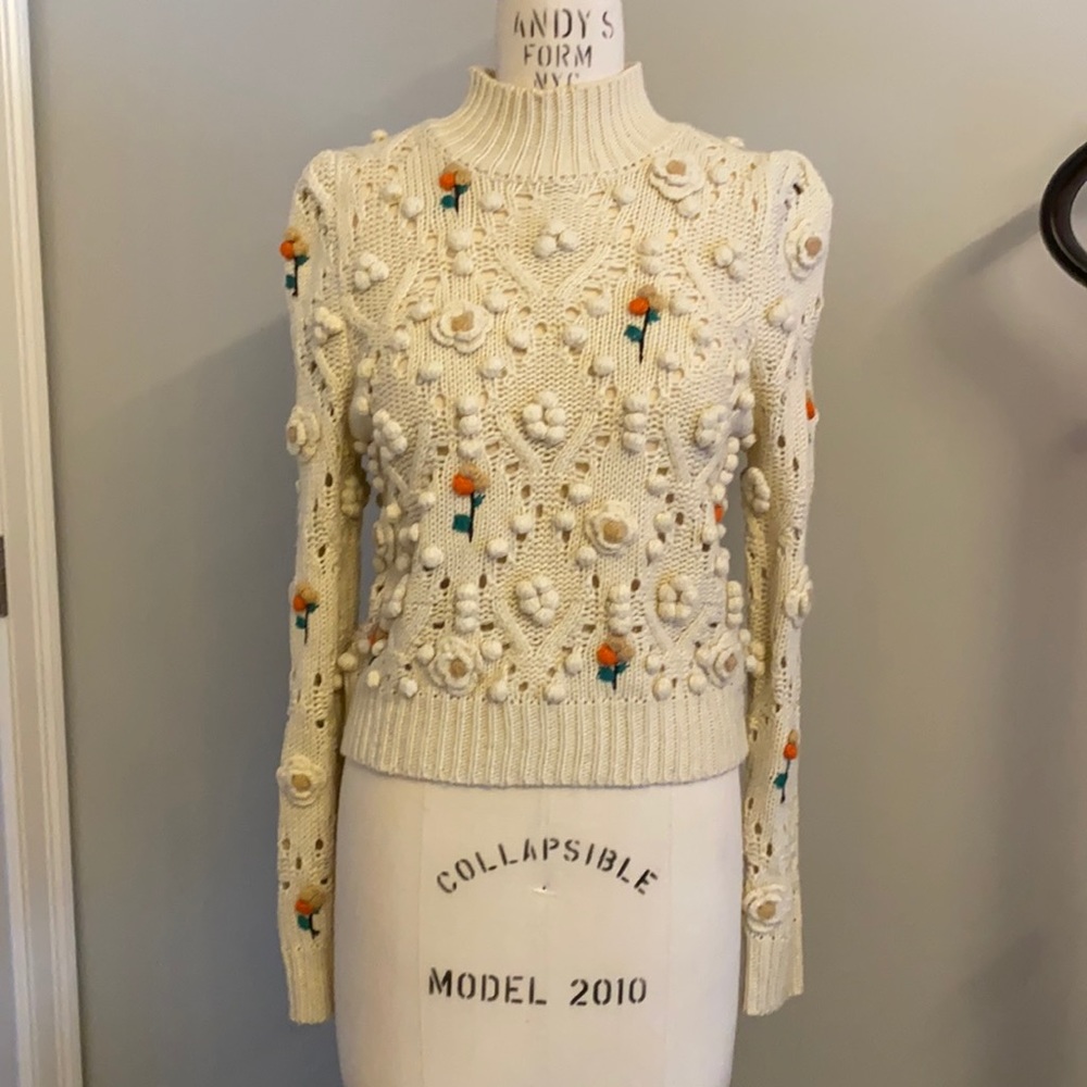 Zara knit sweater with flower detail and high collar. Gathered at the shoulder